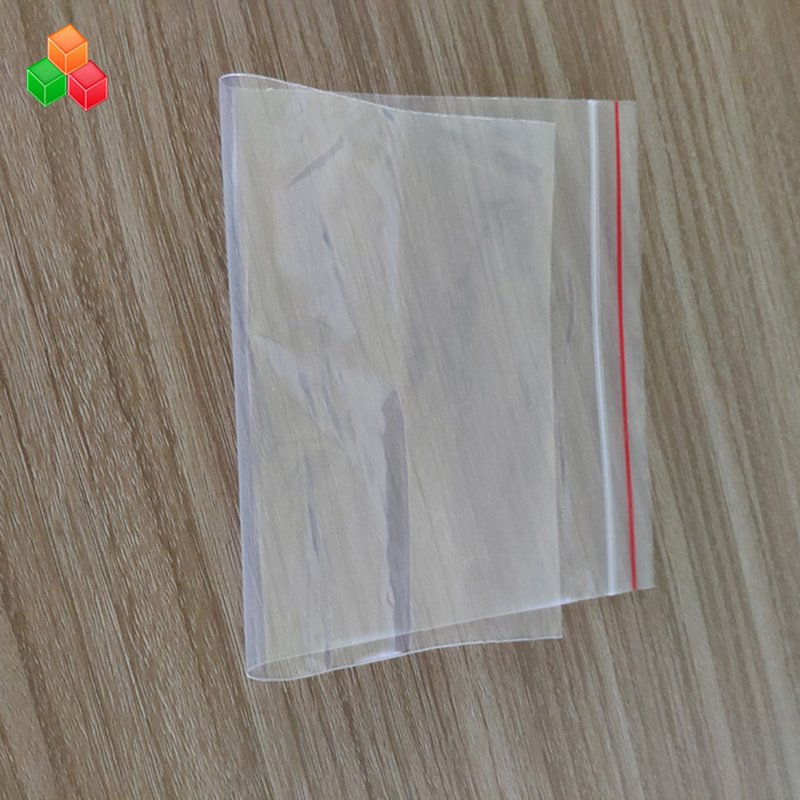 Preço de fábrica personalizado tamanho de impressão reutilizável clara imprensa selo plástico PE PP zip lock saco de embalagem para alimentos / vestuário